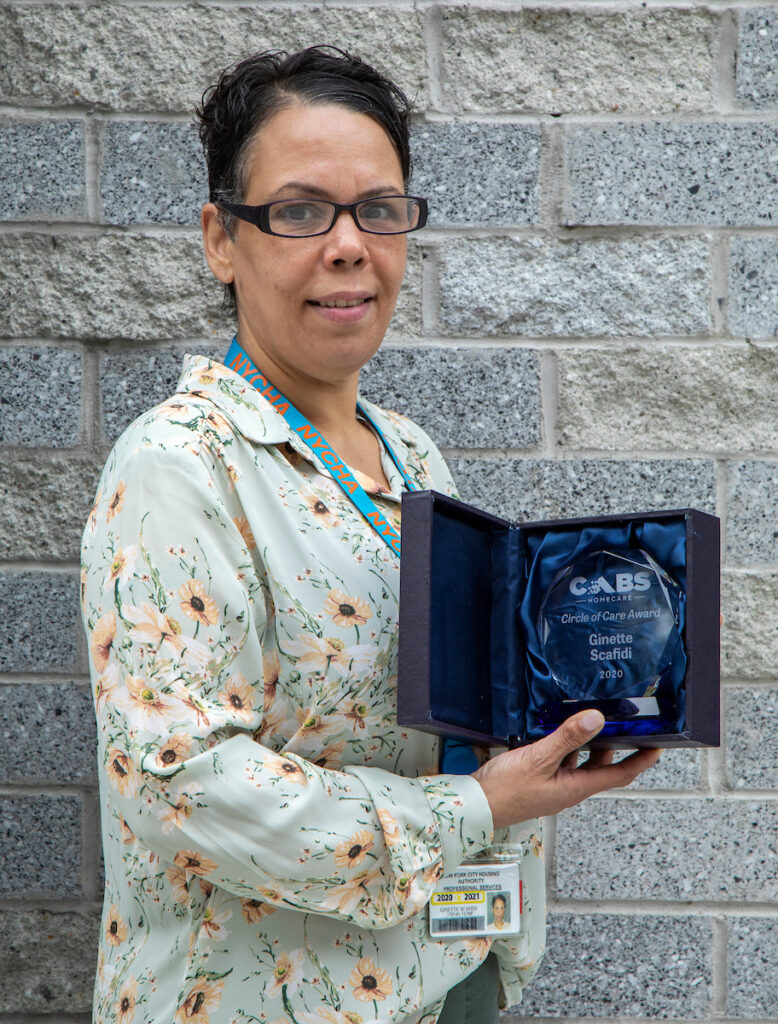 woman holding award