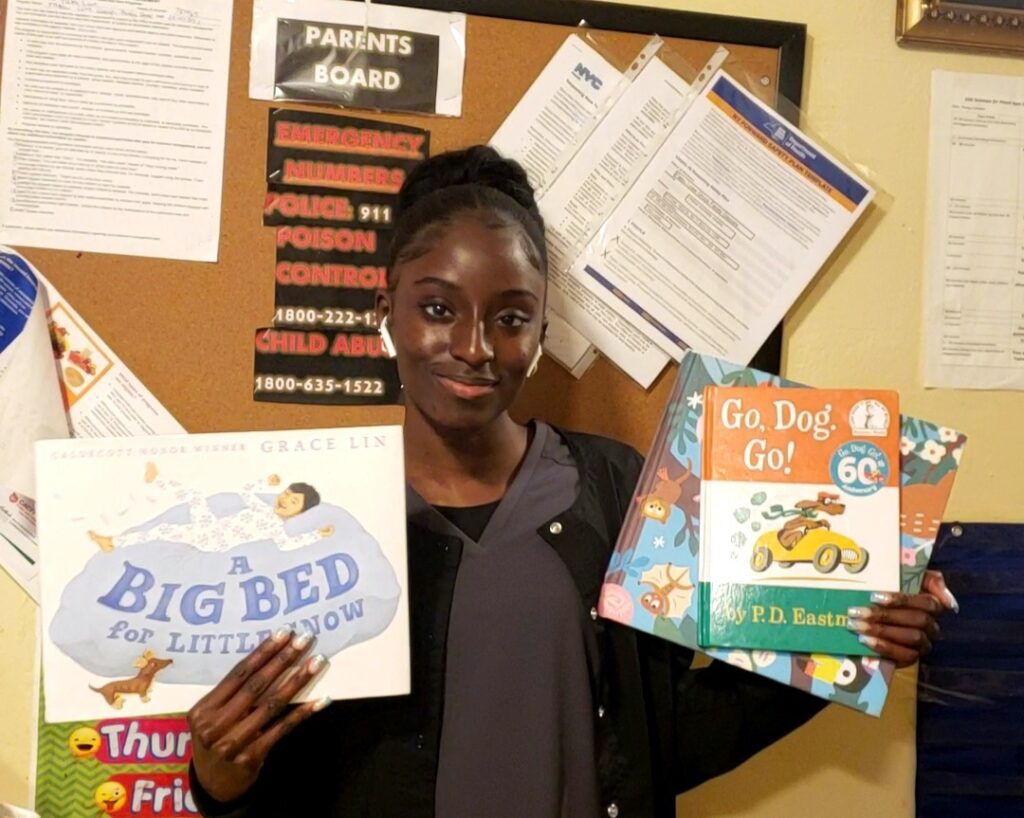 woman holding picture books