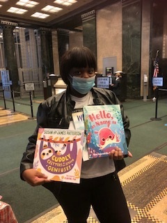 woman holding picture books