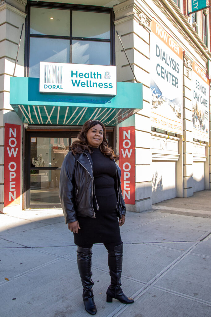 woman standing in front of Doral Health & Wellness center building