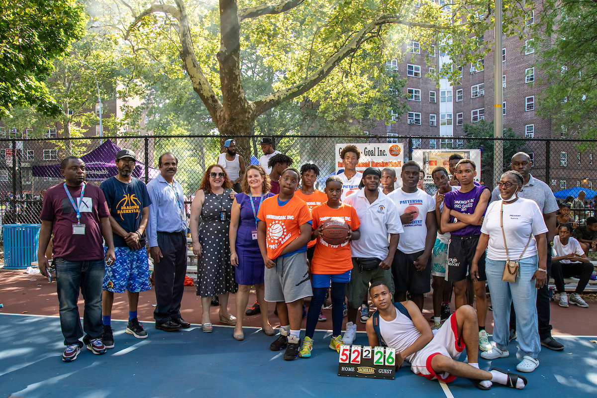 group of people on outdoor basketball court
