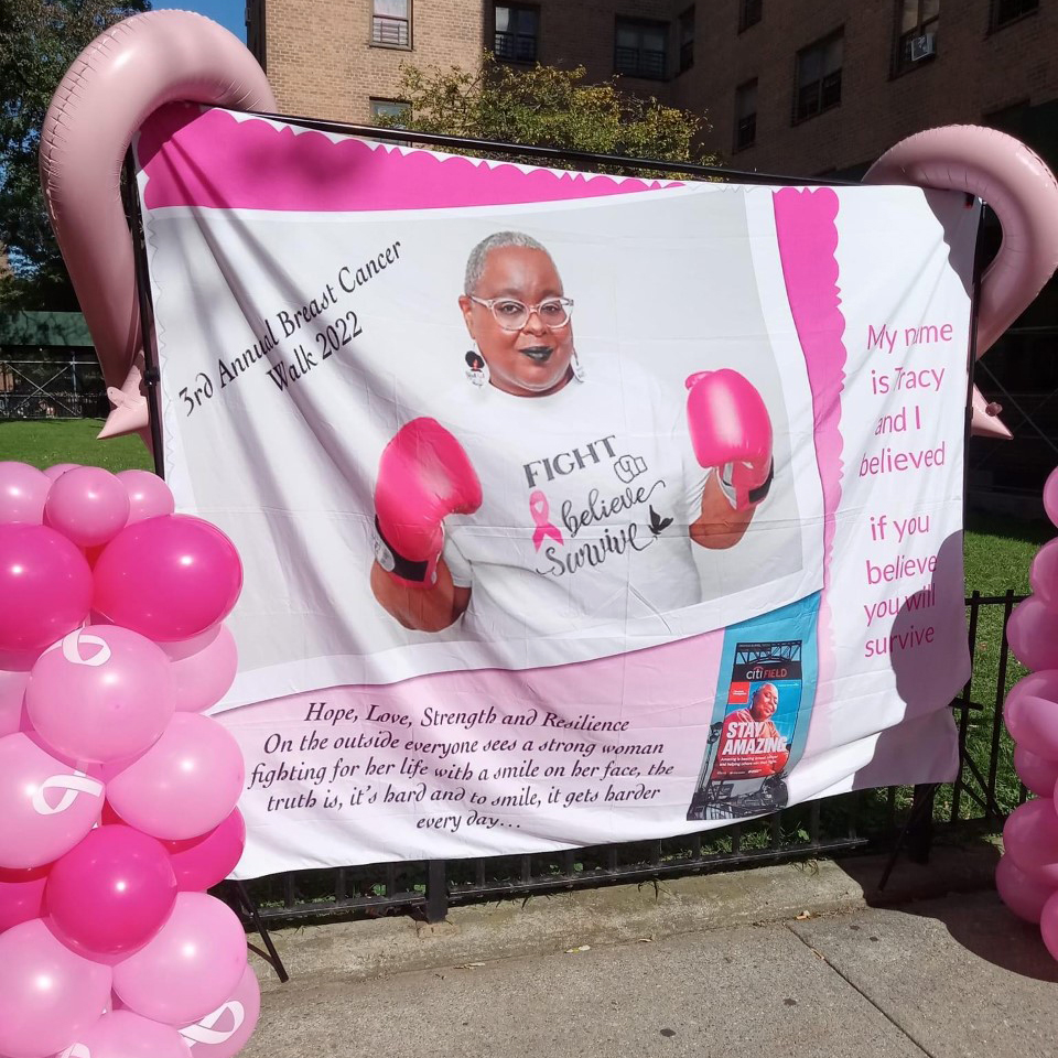 sign for breast cancer walk and pink balloons