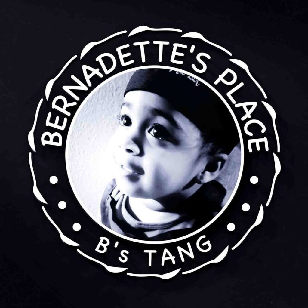 Logo for Bernadette's Place, a child's face