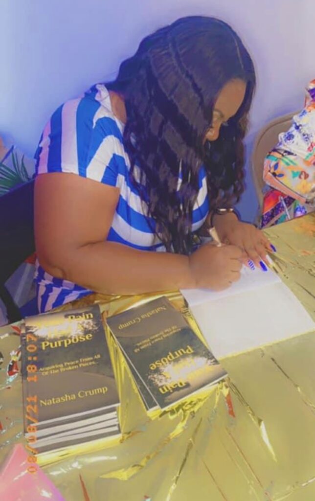 woman signing books