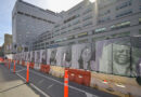 mural on construction fencing in front of building