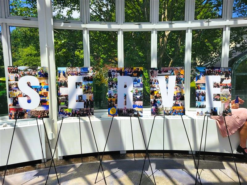 five posterboards spell out the word SERVE