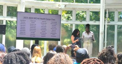 two women on stage, a screen on stage has the words 2023-2024 NYCHA Health Corps Class with a list of names