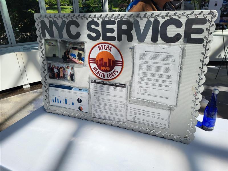 large posterboard presentation with the words NYC Service