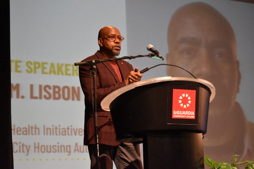 man speaking at podium