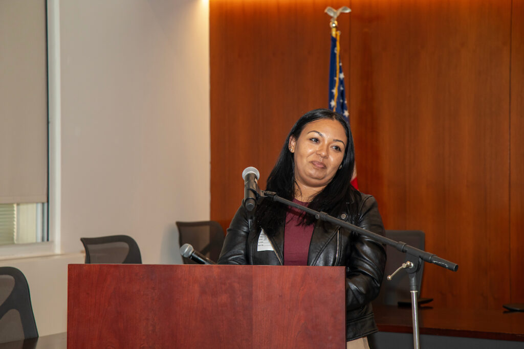 woman speaking at podium