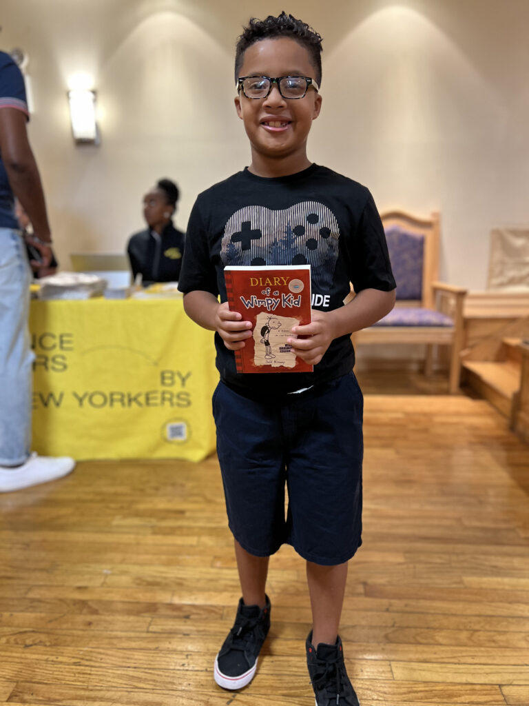 child holding a book