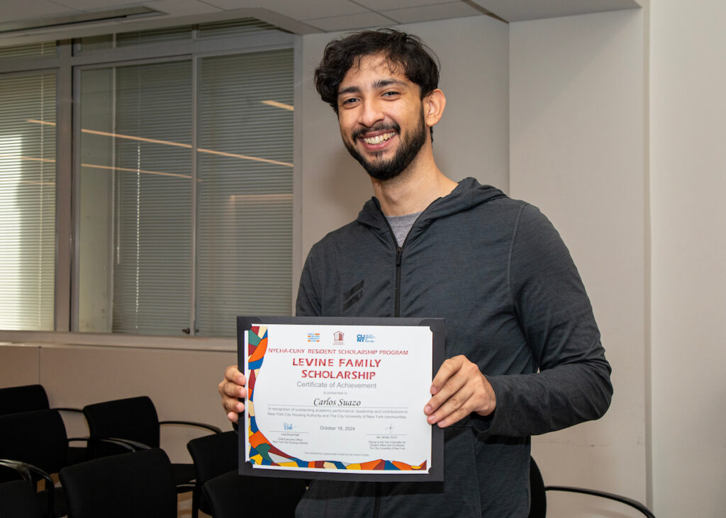 man holding certificate