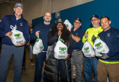 group of people holding turkeys