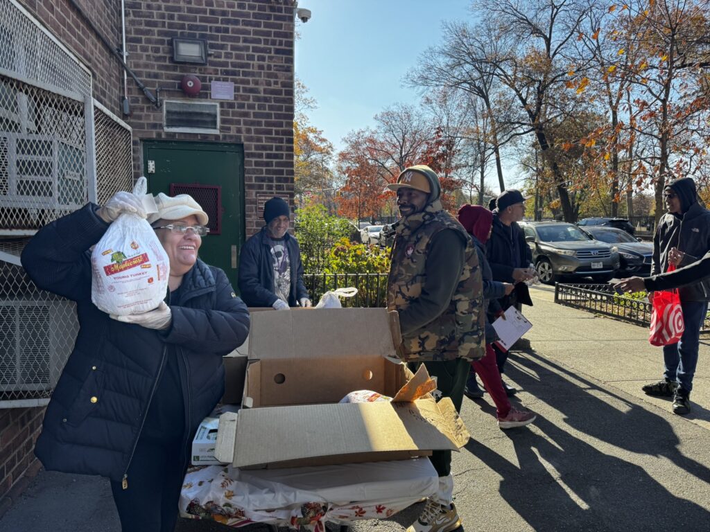 woman holding up a turkey