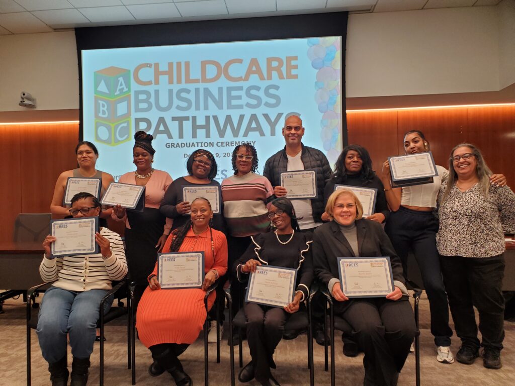 group of people holding certificates