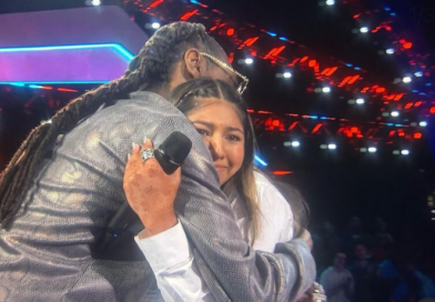 teen girl hugging man with locs (Snoop Dogg)