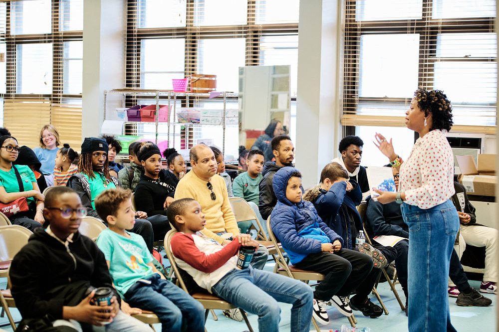 a woman speaking to an audience