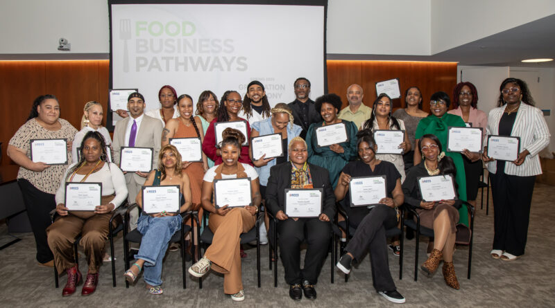 group of people holding certificates