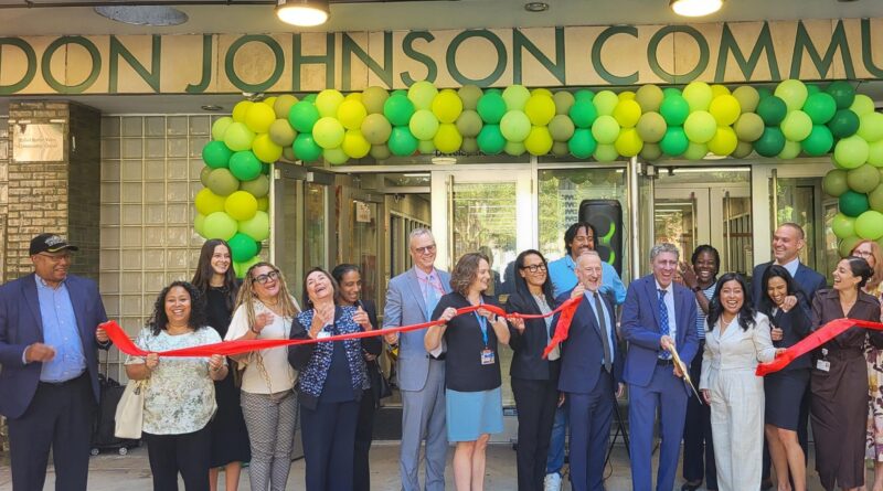 group of people at ribbon cutting