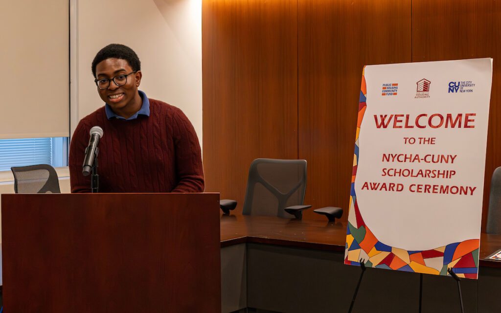 man speaking at podium