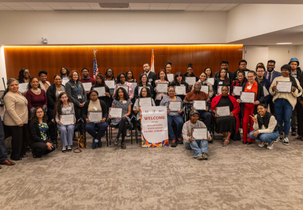 group of people holding certificates