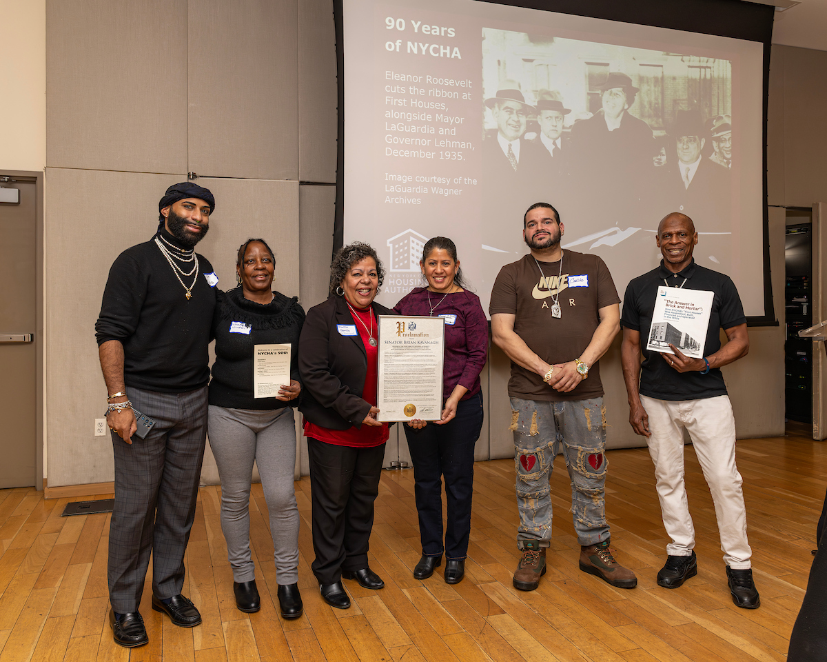 group of people, two hold a proclamation