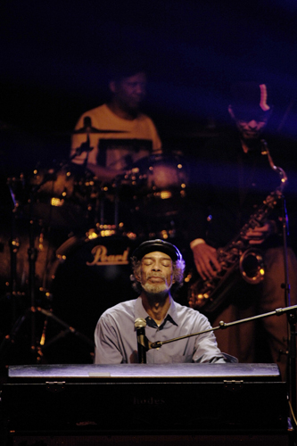 photo of man sitting at keyboard