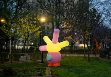 outdoor sculpture illuminated at night