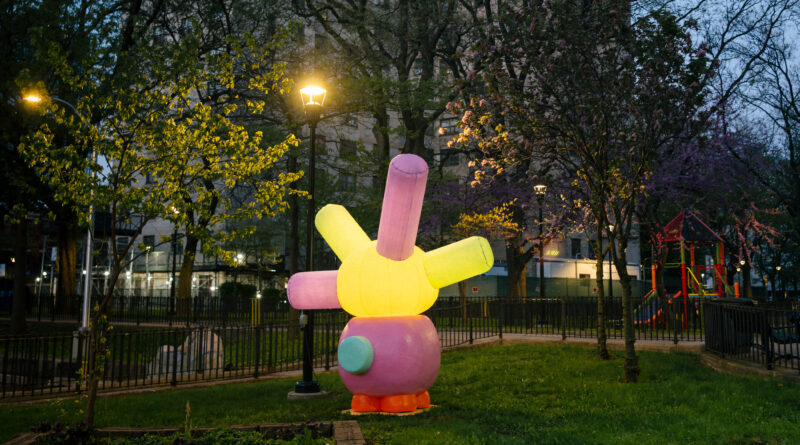 outdoor sculpture illuminated at night