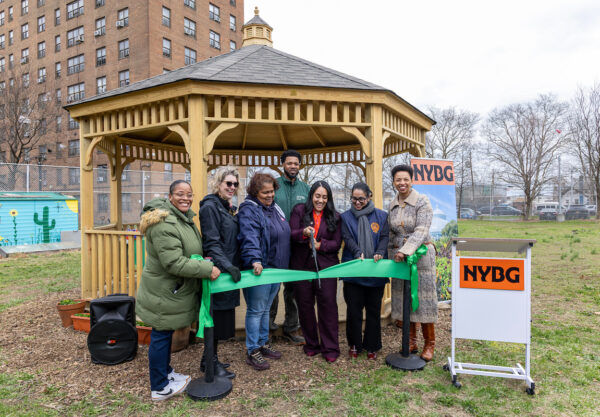people standing in front of a gazebo