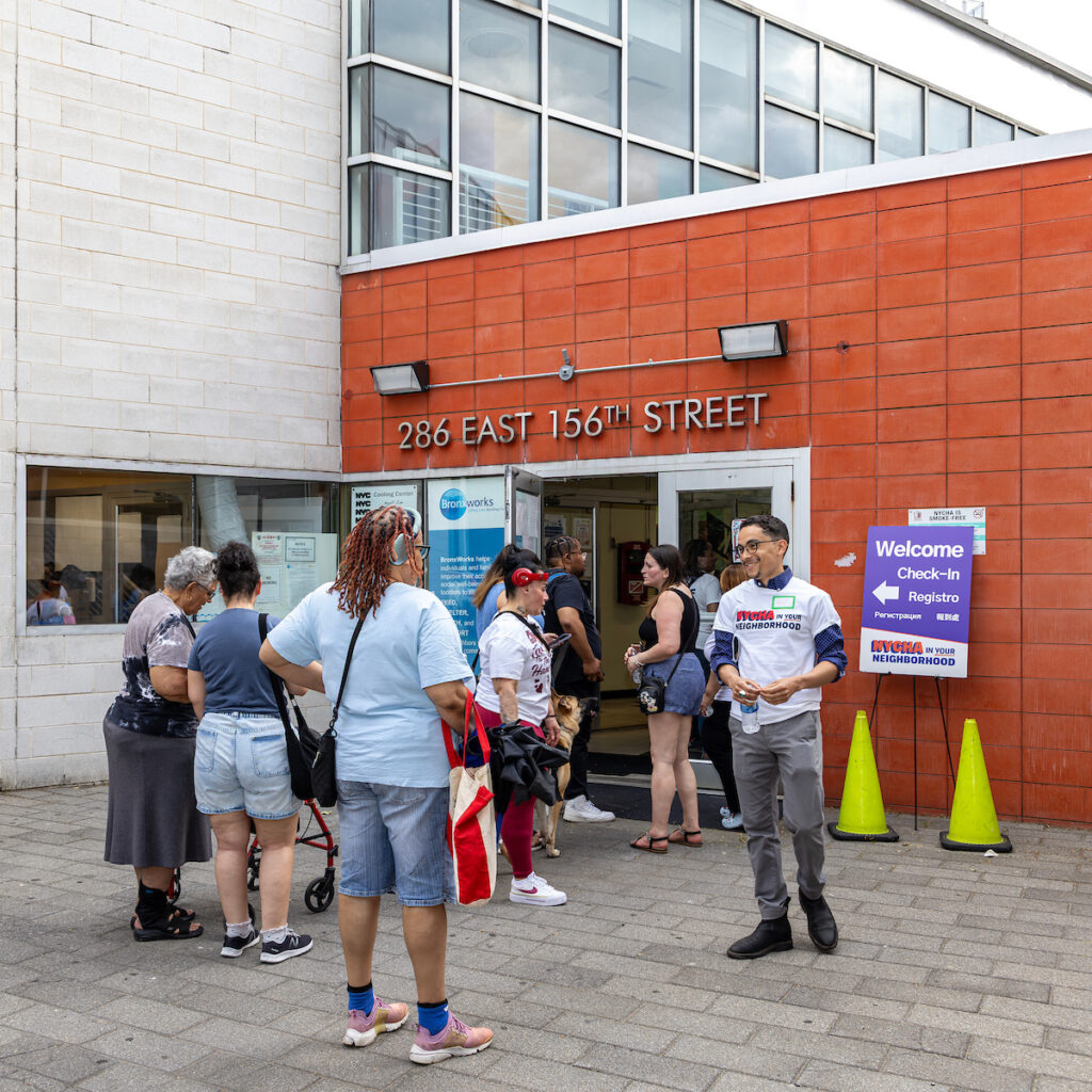 people standing outside of building