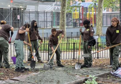 group of people shoveling ground