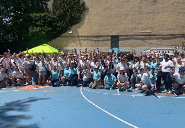 group of people on an outdoor basketball court
