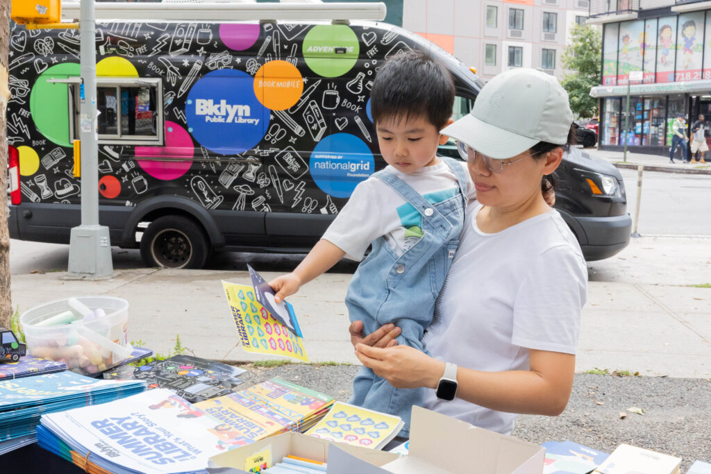 woman and child looking at books