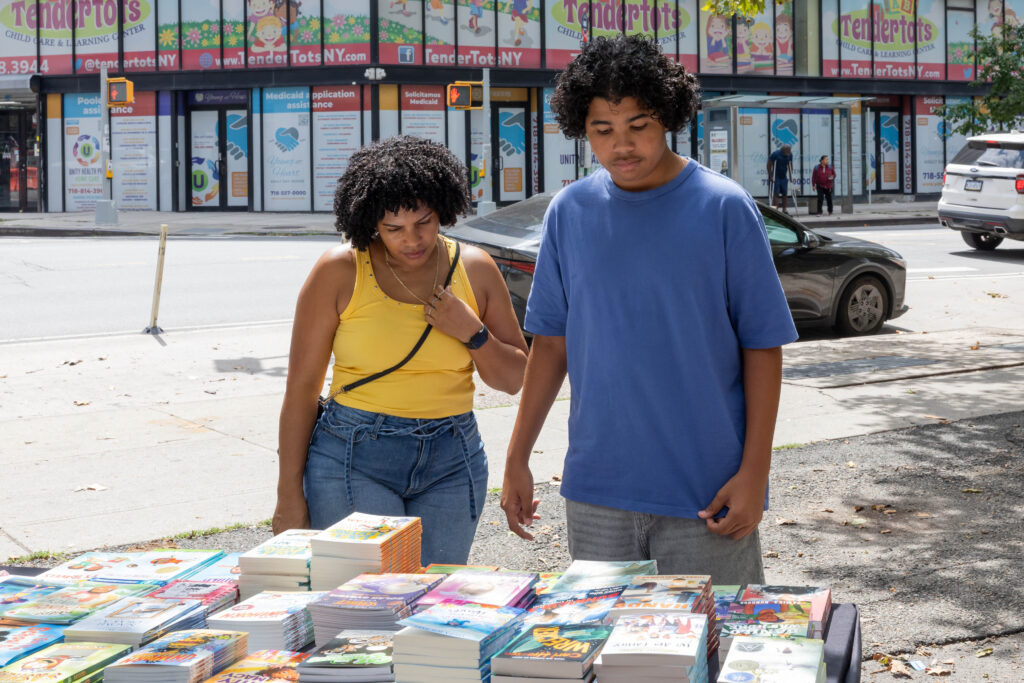 two people looking at books