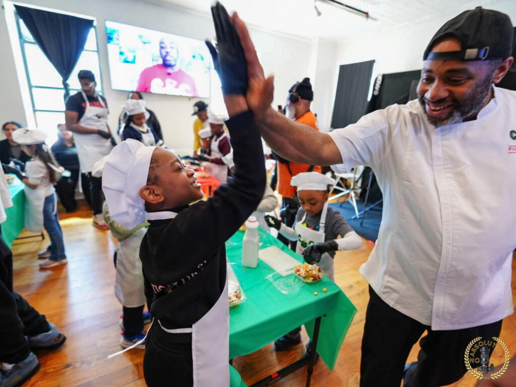 man high fiving a child