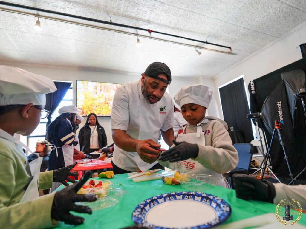 man showing a child how to cook