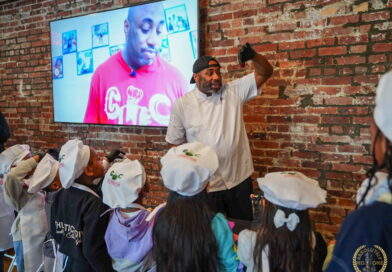 male chef talking to children