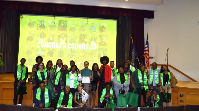 group of graduates standing on stage
