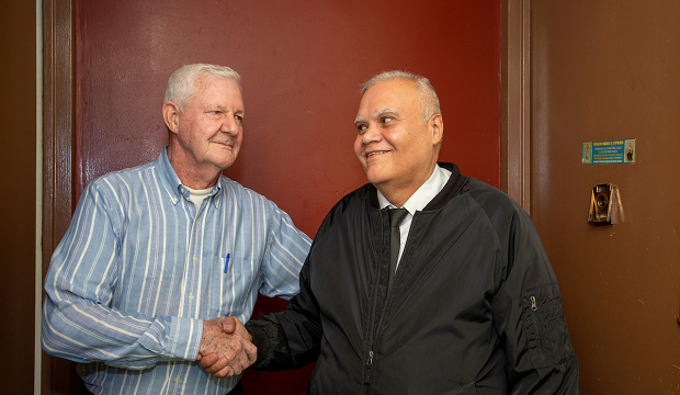 Floor Captain Richard Rosado visits with a neighbor. Floor Captain Richard Rosado visits with a neighbor.
