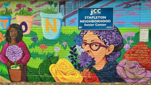 Photos courtesy of Thrive Collective. painted mural with people in a flower garden