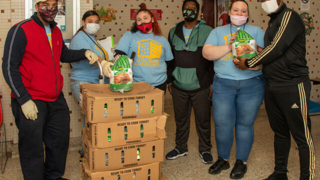 Claremont Consolidation turkeys, bags of produce and food vouchers to senior residents group of people