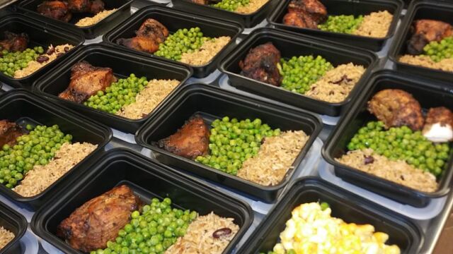 many trays of prepared meals