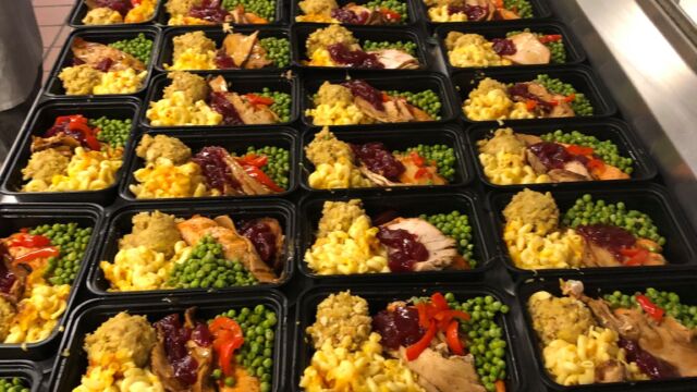 many trays of prepared meals