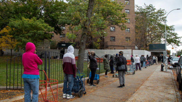 Astoria Houses and Urban Upbound Gas Outage Food Distribution people with shopping carts standing on line