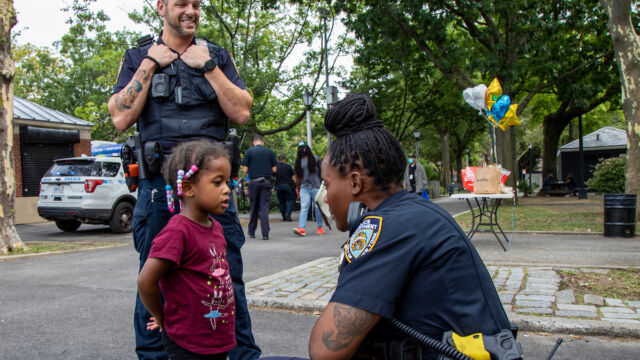 National Night Out at Linden Park two police officers talking to very young child