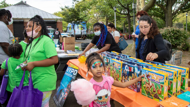National Night Out at Linden Park child picking out game at outdoor event
