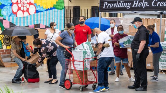 Food drive by Catholic Charities for Betances households (photo credit: Takao Araki) Food drive for residents
