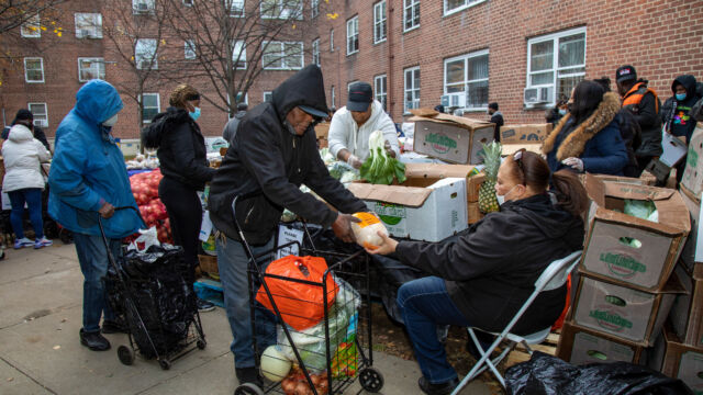 Thanksgiving Food and Turkey Distribution at Breukelen Houses person accepting food