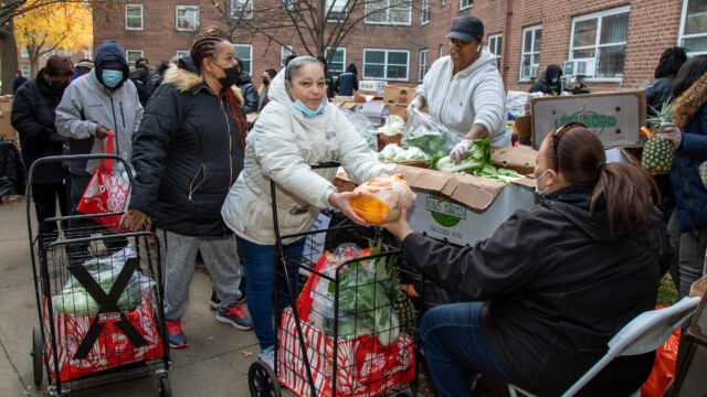Thanksgiving Food and Turkey Distribution at Breukelen Houses people accepting food